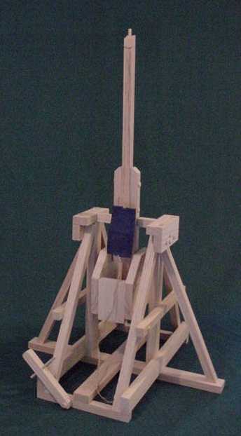 Photo of plans for how to build a trebuchet showing the trebuchet in the fired positon