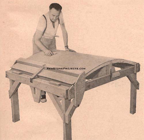 Sanding the plywood panel that covers the top of kitchenette lid. The underside is covered with a similar panel, and the lid attached to the sleeping compartment by means of a continuous, piano-type hinge.