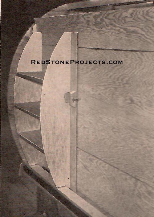 Shelves in compartment at forward end of trailer, reached through door in bulkhead.