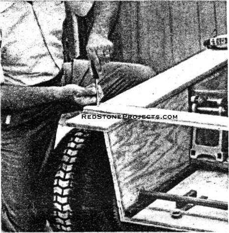 TEMPORARY CLEATS keep body sides aligned while installing engine and drive.