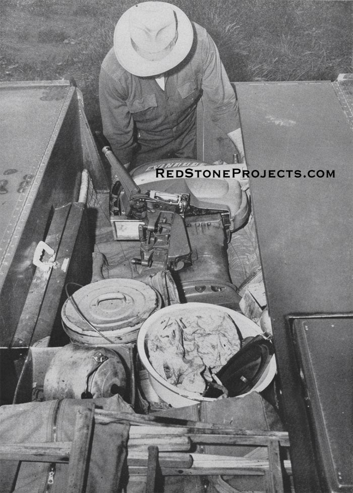 The nearly eight-foot trailer box affords tremendous storage space for camp equipment and motor. note welded-in shelf and cut out section or mounting gasoline or butane camp stove.