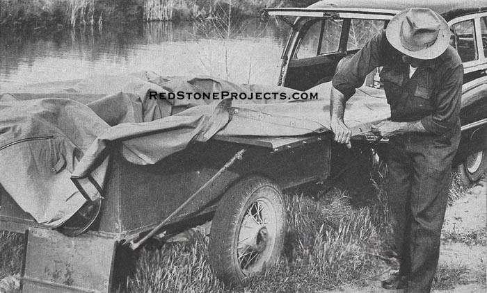 For two men, especially in bad weather, it is easiest to snap the cover to the wings, then raise the ridgepoles and position the spreader arms.