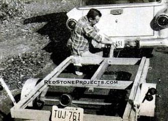 Trailer, designed for the boat, is simple and sturdy. It’s made basically of two-by-fours held together with angle irons at each corner, as shown in the photograph below.