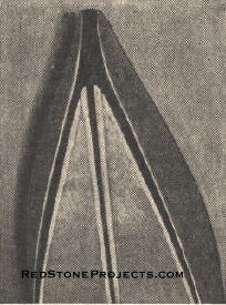 Here's the bow end, showing the use of canvas which serves as hinges for the bottom and sides.