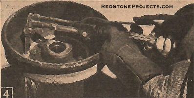 Figure 4. Welding Torch burns brake drums off wheels.