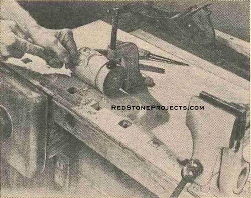 Figure 7. Surface Clamps, such as this one holding carving, are held by bolts that fit in T-slot in clamp. Bolt drops flush.