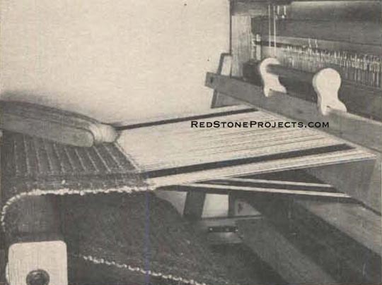 Figure 19. Size of the shed is restored after each few inches of weaving by winding up some fabric on the cloth beam.
