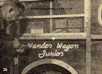 Photo 26. Applying the Wander Wagon Logo.